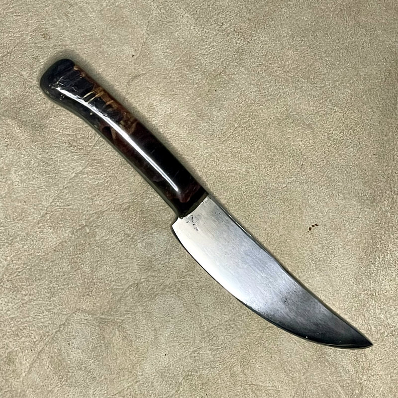knife with high gloss composite wood handle in light and dark browns